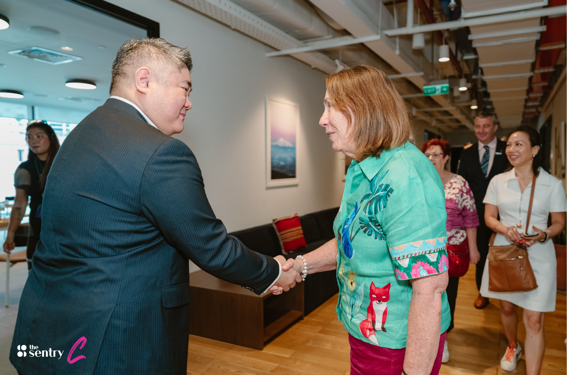 Business partners shaking hands at a networking event in Ho Chi Minh City