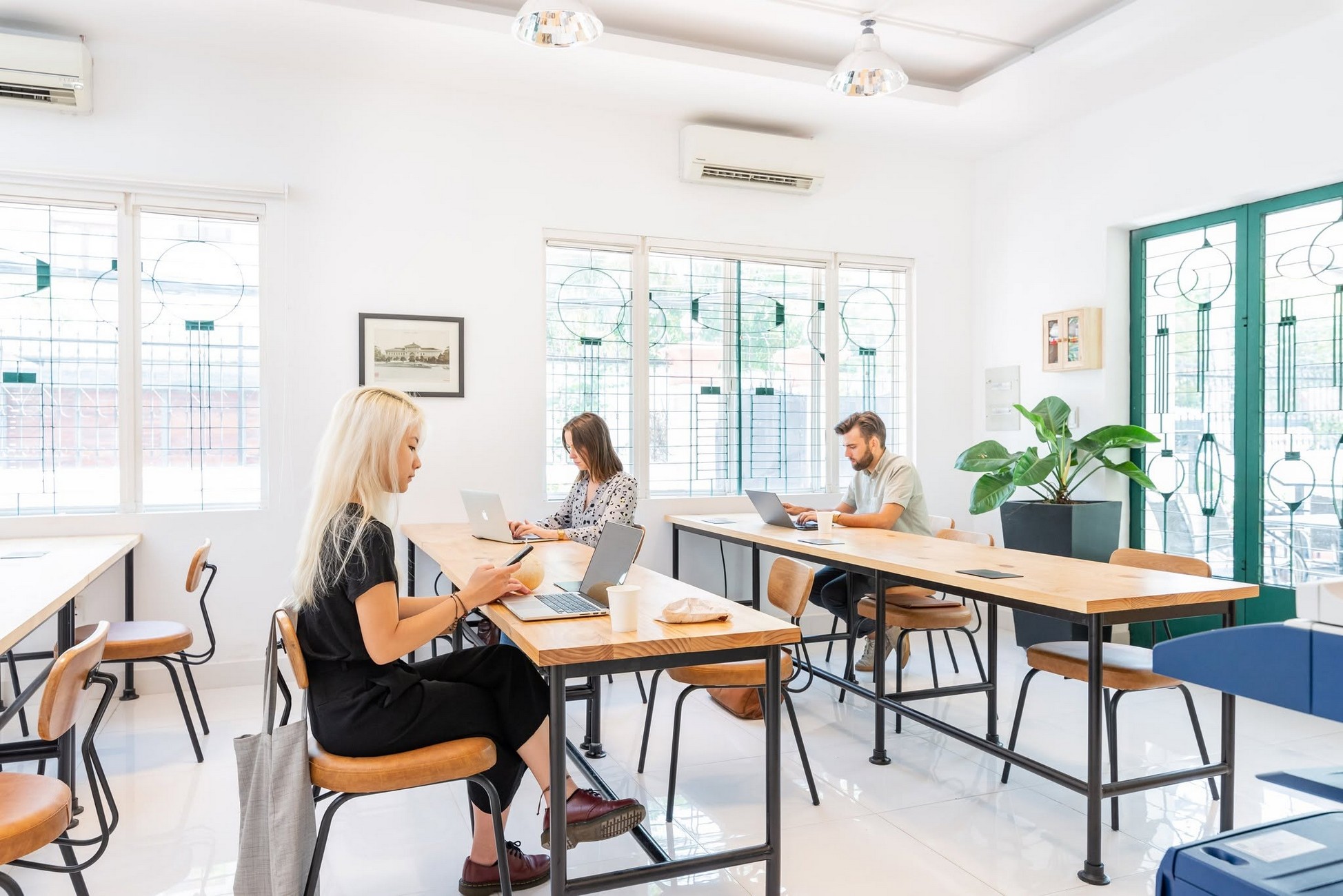 The Hive Thao Dien coworking space with shared desks in a bright interior