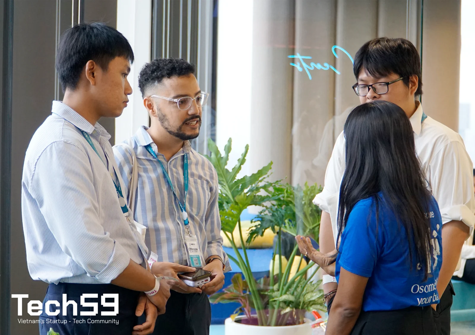 Business professionals networking at a Tech59 community event